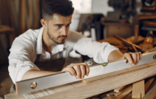Handsome Carpenter Working With A Wood